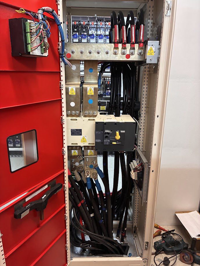 Distribution panel internals with busbar and breakers